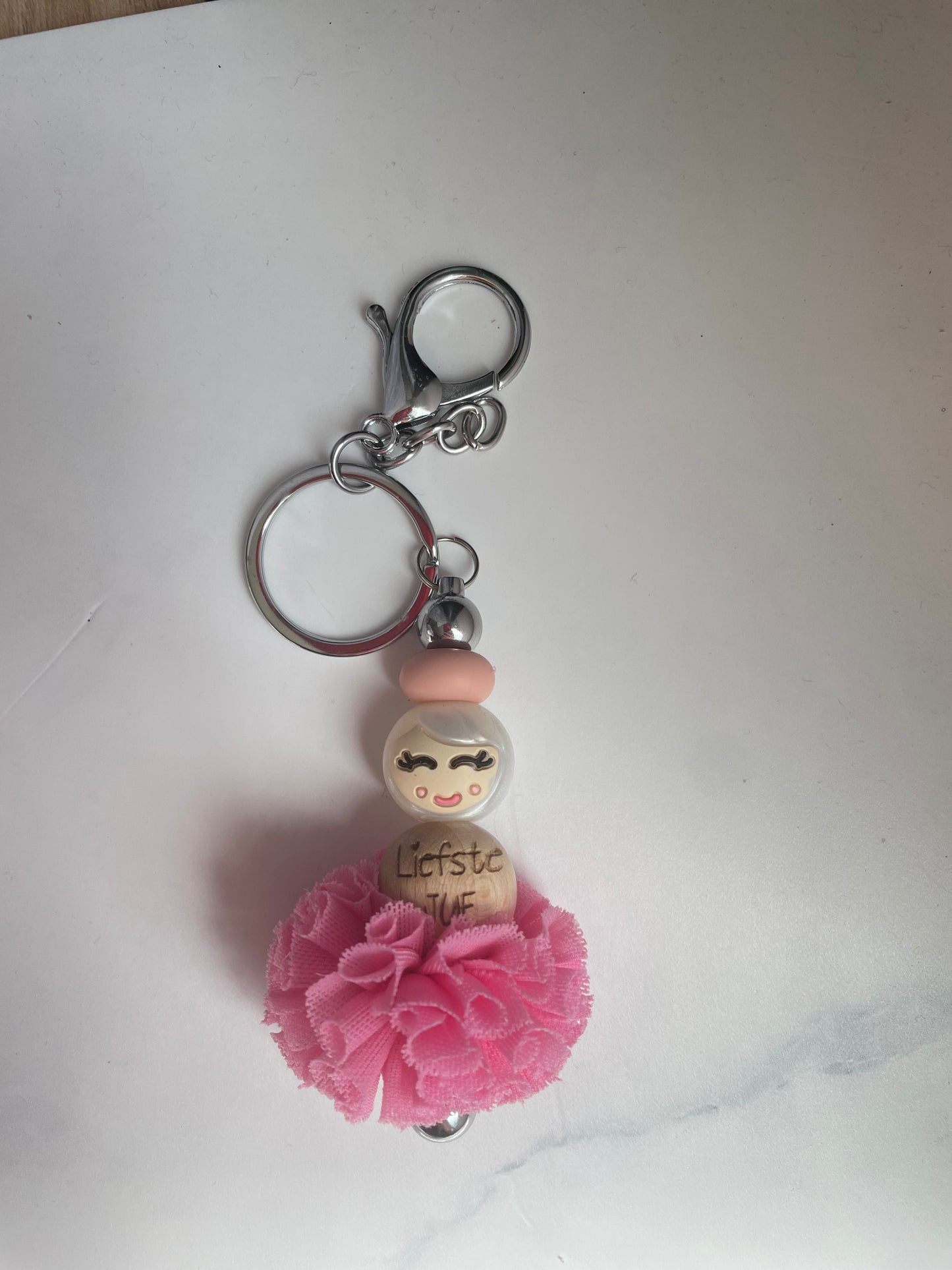 Jufje van geluk met pompon
