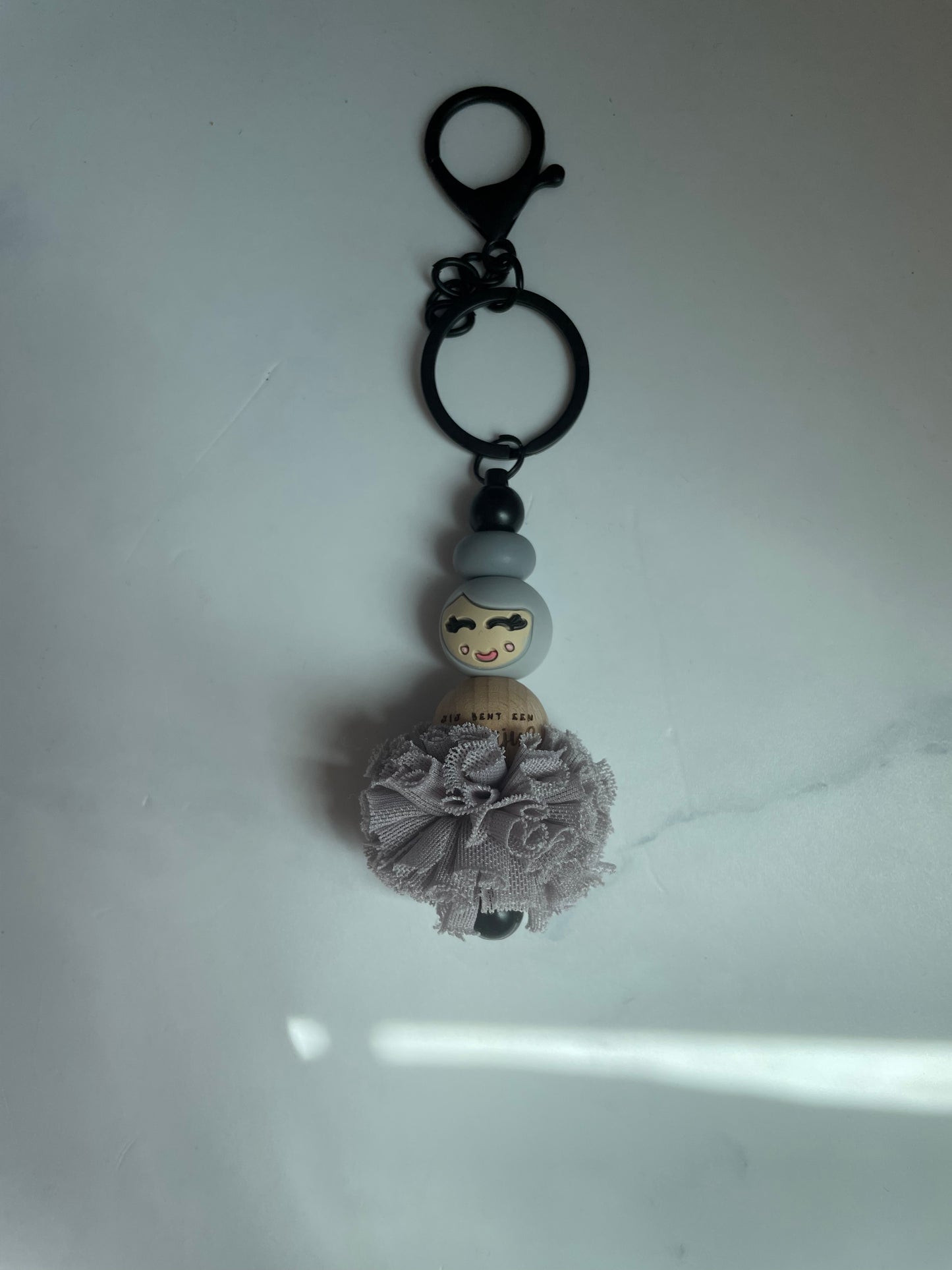Jufje van geluk met pompon
