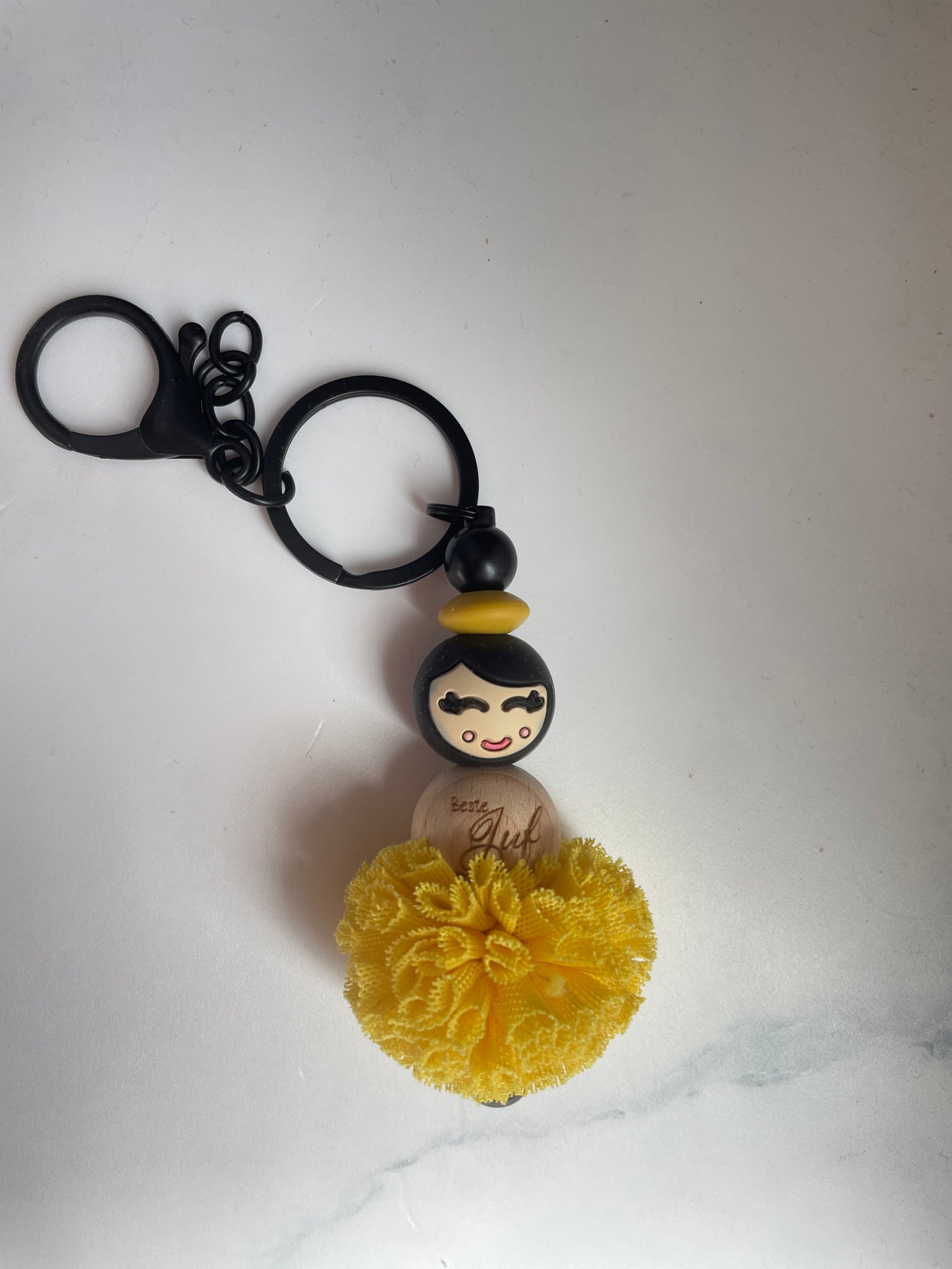 Jufje van geluk met pompon